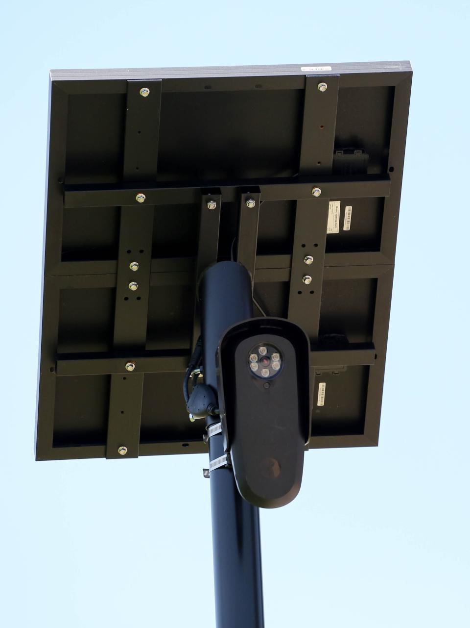 A Flock automatic license plate reader camera, owned by Penn Square Mall, stands near the south mall entrance.
