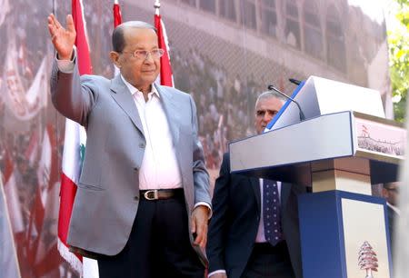 Lebanese Christian leader and founder of the Free Patriotic Movement (FPM) Michel Aoun greets his supporters during a rally to show support for him and to mark the October 13 anniversary, near the presidential palace in Baabda, near Beirut, Lebanon October 11, 2015. REUTERS/Mohamed Azakir