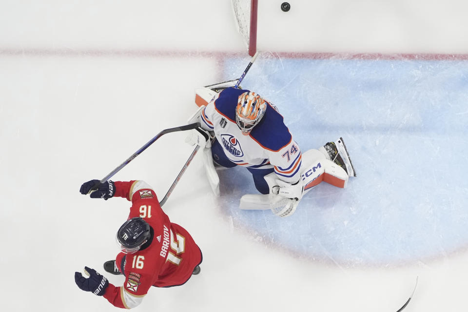 Florida Panthers center Aleksander Barkov (16) celebrates after center Evan Rodrigues, not shown, scored against Edmonton Oilers goaltender Stuart Skinner (74) during the third period of Game 2 of the Stanley Cup Finals, Monday, June 10, 2024, in Sunrise, Fla. (AP Photo/Wilfredo Lee)