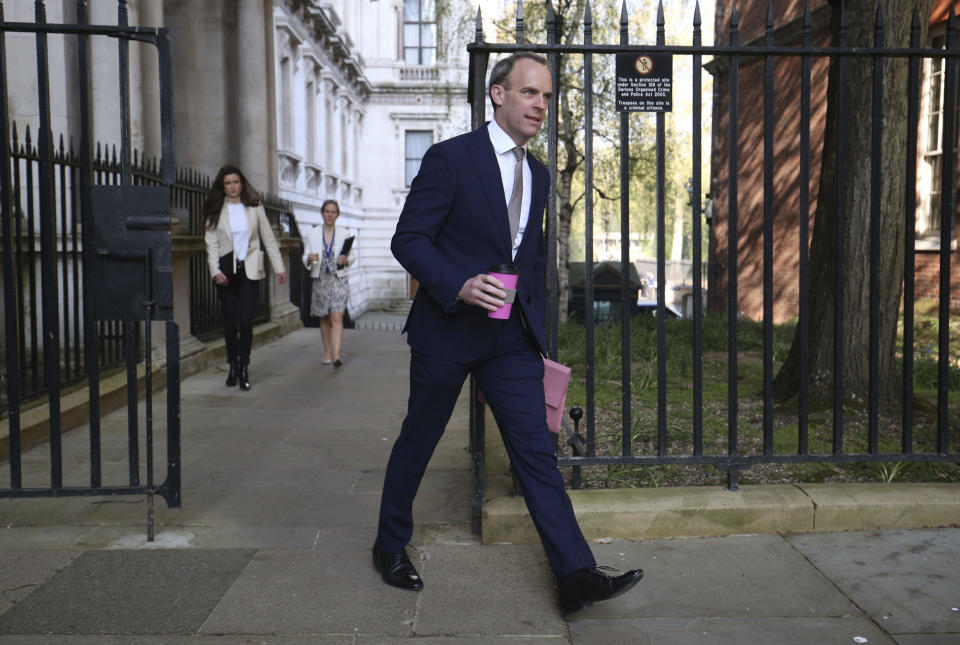 British Foreign Secretary, Dominic Raab arrives in Downing Street, London, Thursday April 16, 2020.  Raab is deputising for Prime Minister Boris Johnson, who remains at Chequers country home, where he is convalescing following his hospitalisation with coronavirus. (Jonathan Brady/PA via AP)