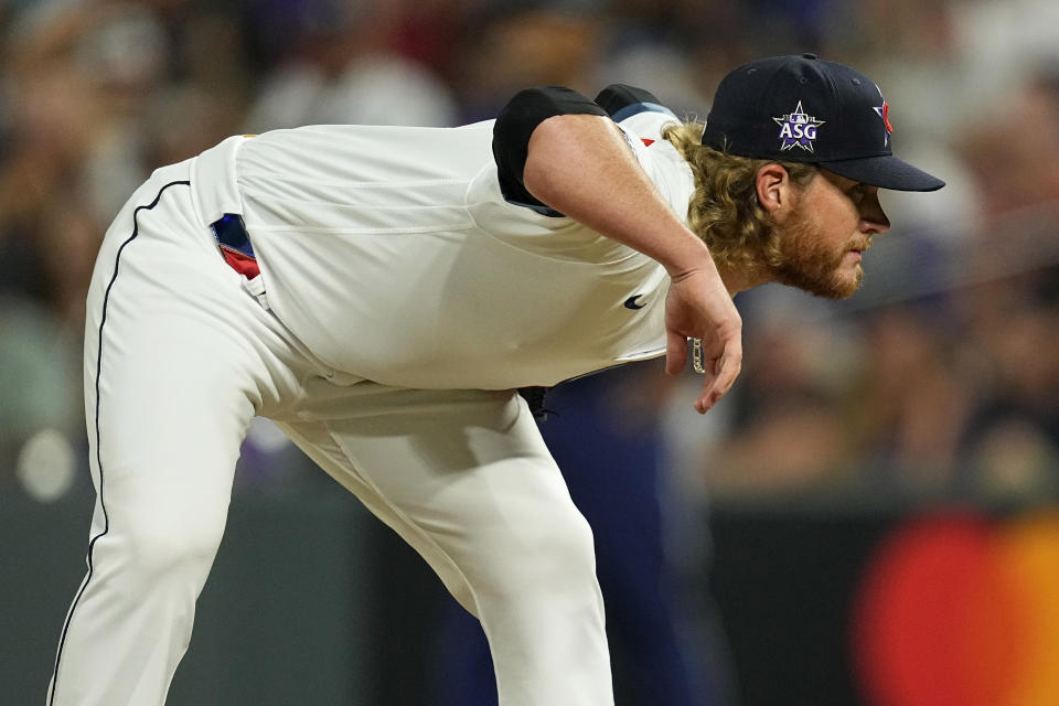 National League's Craig Kimbrel, of the Chicago Cubs, looks for the sign during the ninth inning of the MLB All-Star baseball game, Tuesday, July 13, 2021, in Denver. (AP Photo/Jack Dempsey)