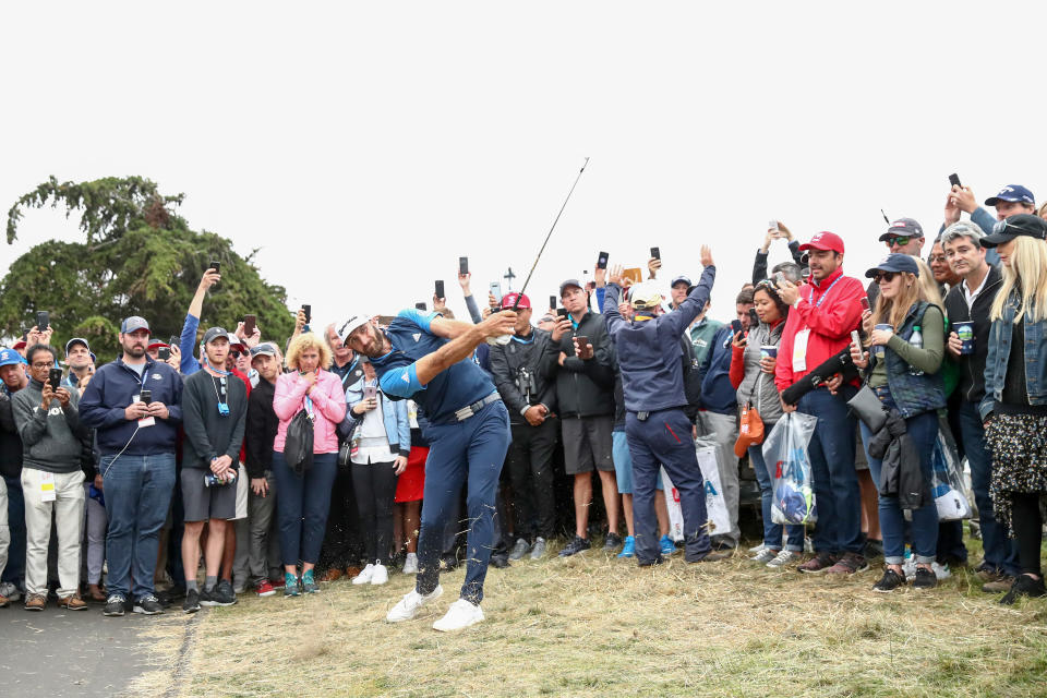 PEBBLE BEACH, CALIFORNIA - JUNE 14: Dustin Johnson of the United States plays a second shot on the 18th hole during the second round of the 2019 U.S. Open at Pebble Beach Golf Links on June 14, 2019 in Pebble Beach, California. (Photo by Ezra Shaw/Getty Images)