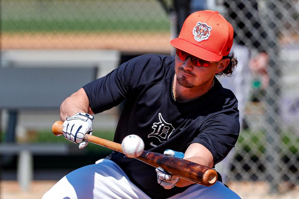 Detroit Tigers outfielder Zach McKinstry bunts during spring training at TigerTown in Lakeland, Fla. on Wednesday, Feb. 21, 2024.