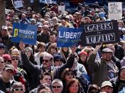 Demonstrators gather at Monument Circle to protest a controversial religious freedom bill recently signed by Governor Mike Pence, during a rally in Indianapolis March 28, 2015. More than 2,000 people gathered at the Indiana State Capital Saturday to protest Indiana's newly signed Religious Freedom Restoration Act saying it would promote discrimination against individuals based on sexual orientation. (REUTERS/Nate Chute)