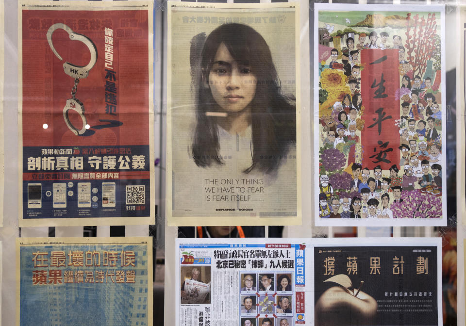 Layouts of Apple Daily are displayed outside the office of an editor at the news room Monday, April 26, 2021, in Hong Kong. The Apple Daily editors and executives were detained Thursday, June 17, under a national security law that took effect last year. (AP Photo/Vincent Yu)