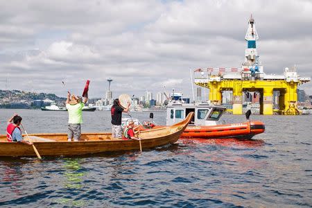 Members of the Duwamish Tribe protest the Shell Oil Company's drilling rig Polar Pioneer in Seattle, Washington, May 14, 2015. REUTERS/Matt Mills McKnight