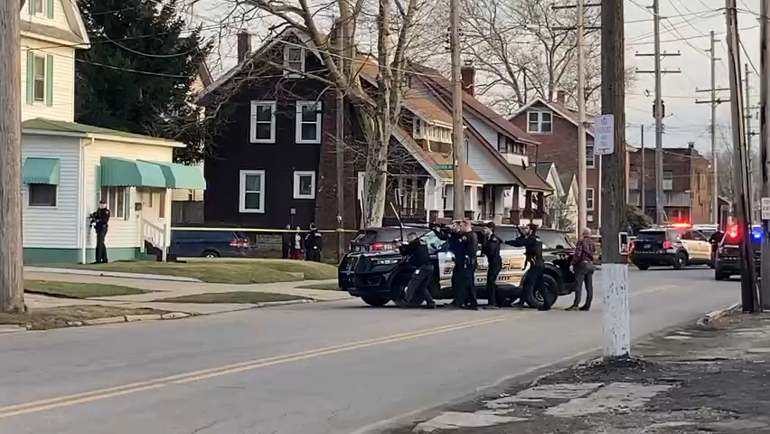At 5 p.m. on Feb. 2, 2023, Erie police officers enter a house at Cherry Street and Stafford Avenue, near West 29th Street, to investigate a shooting.