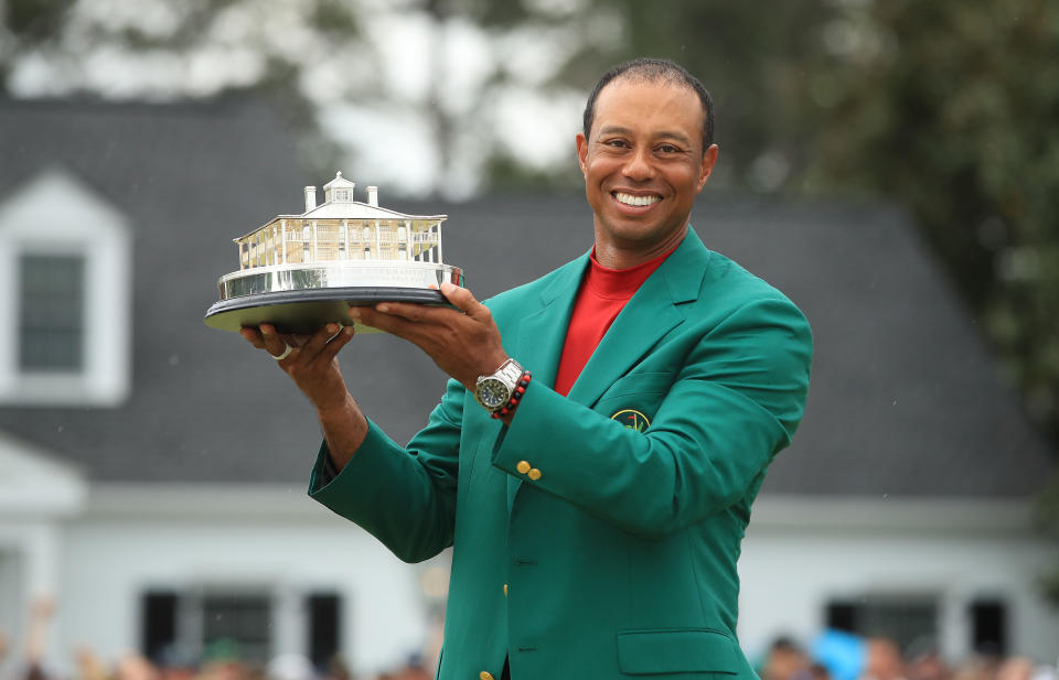 Tiger holds The Masters trophy after winning