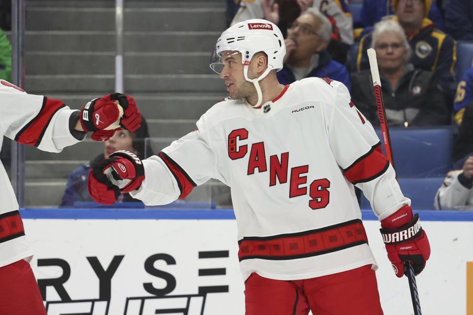 Carolina Hurricanes defenseman Tony DeAngelo (77) celebrates his goal during the first period of an NHL hockey game against the Buffalo Sabres, Sunday, Feb. 25, 2024, in Buffalo, N.Y. (AP Photo/Jeffrey T. Barnes)