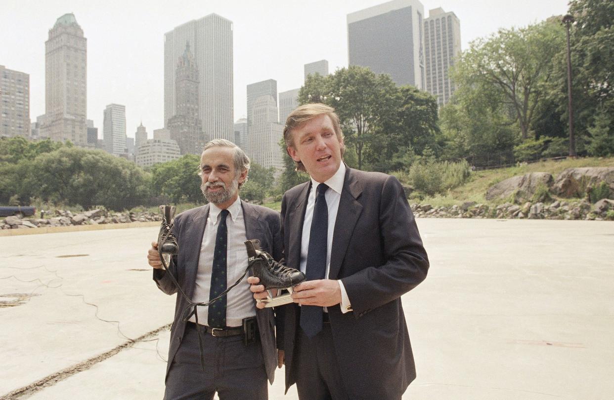 Developer Donald Trump, right, poses with New York City's Park Commissioner Henry Stern holding a pair of ice skates that are intended for use at the Wollman Skating Rink Central Park in New York, on Aug. 7, 1986.