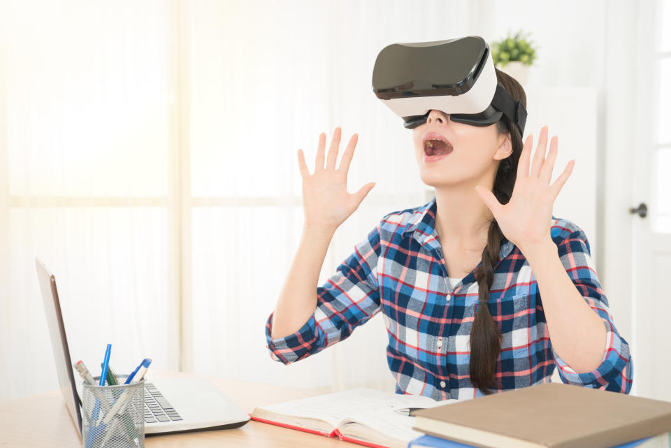 shocked woman enjoying virtual reality