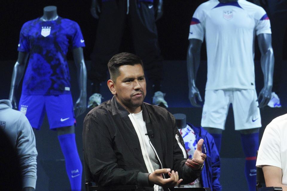 Rolando Cruz, Nike apparel product line manager, speaks during Nike's display of World Cup uniforms for the U.S. men's and women's teams, Wednesday, Aug. 31, 2022, in New York. (AP Photo/Bebeto Matthews)