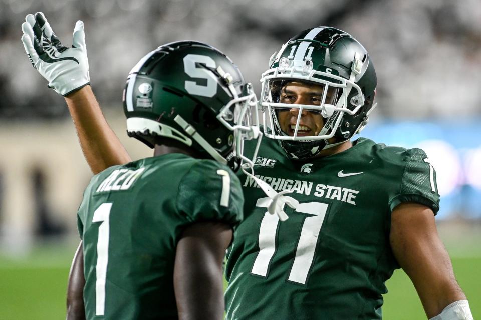 Michigan State's Jayden Reed, left, celebrates his touchdown with Connor Heyward during the fourth quarter in the game against Nebraska on Saturday, Sept. 25, 2021, at Spartan Stadium in East Lansing.