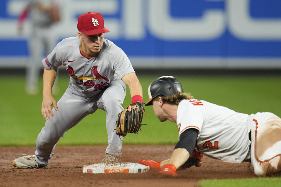 Baltimore Orioles' Gunnar Henderson, right, reaches second ahead of a tag by St. Louis Cardinals second baseman Tommy Edman on a double in the third inning of a baseball game, Tuesday, Sept. 12, 2023 in Baltimore. (AP Photo/Julio Cortez)