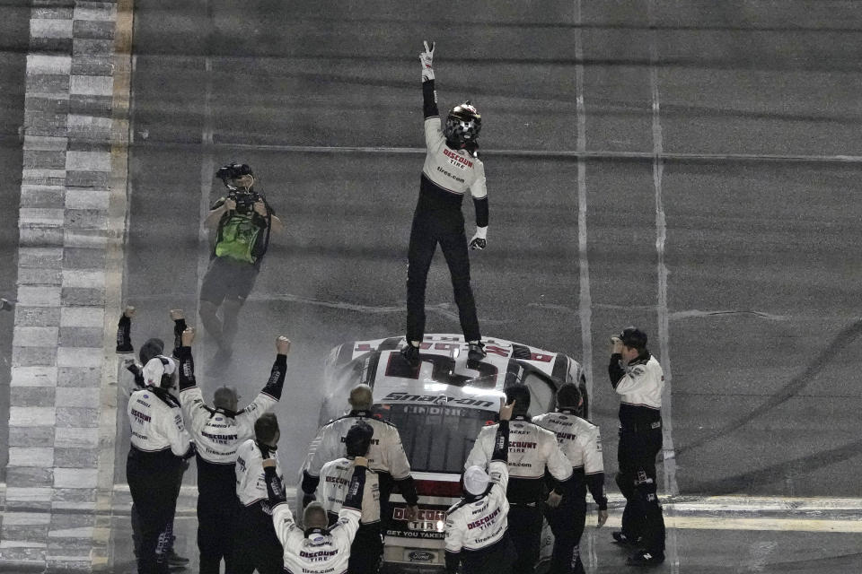 Austin Cindric celebrates on top of his car after winning the NASCAR Daytona 500 auto race Sunday, Feb. 20, 2022, at Daytona International Speedway in Daytona Beach, Fla. (AP Photo/Chris O'Meara)