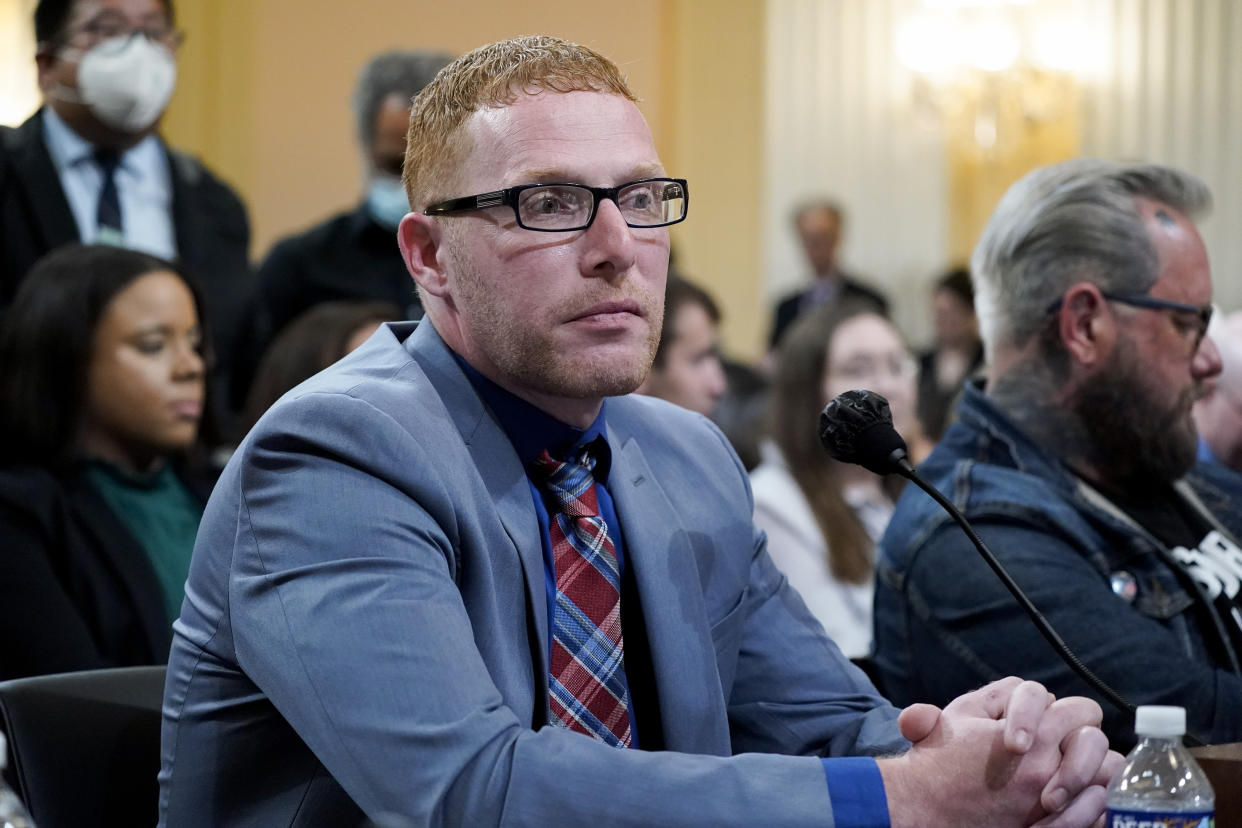 Stephen Ayres, who pleaded guilty in June 2022 to disorderly and disruptive conduct in a restricted building, left, and Jason Van Tatenhove, an ally of Oath Keepers leader Stewart Rhodes, right, arrive to testify as the House select committee investigating the Jan. 6 attack on the U.S. Capitol holds a hearing at the Capitol in Washington, Tuesday, July 12, 2022. (AP Photo/J. Scott Applewhite)