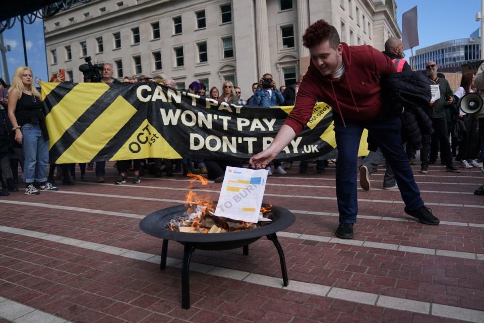 Don’t Pay activists set fire to energy bills (PA)