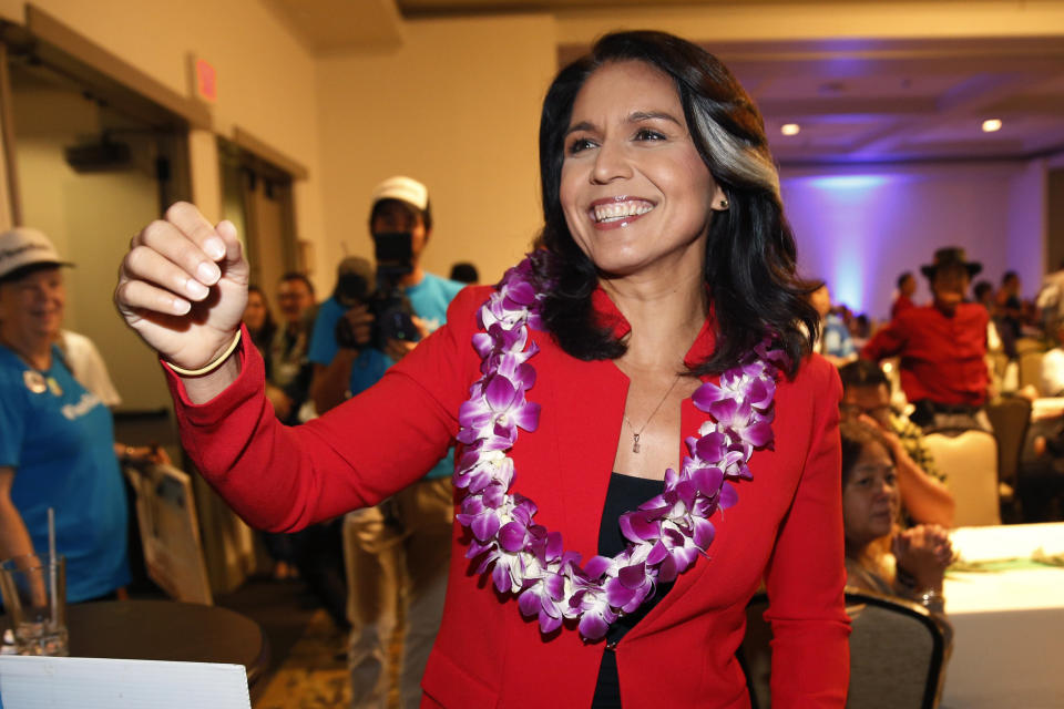 FILE - In this Nov. 6, 2018, file photo, Rep. Tulsi Gabbard, D-Hawaii, greets supporters in Honolulu. The 2020 presidential election already includes more than a half-dozen Democrats whose identities reflect the nation’s growing diversity, as well as embody the coalition that helped Barack Obama first seize the White House in 2008 (AP Photo/Marco Garcia, File)