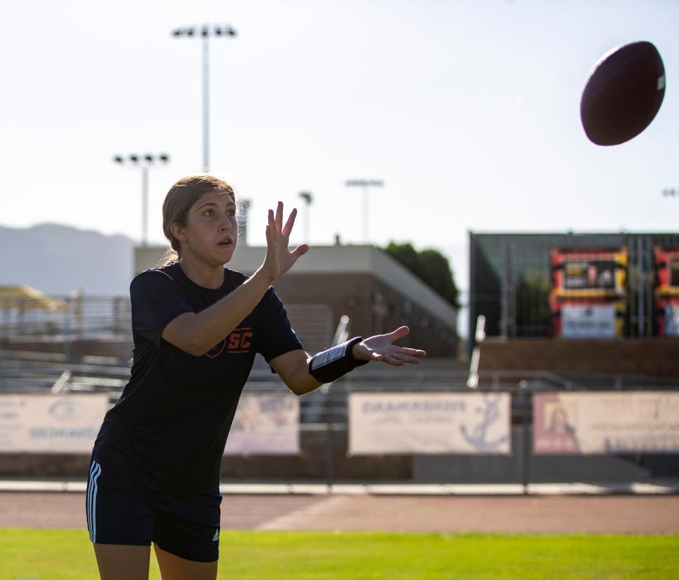 Madeline Scott reaches up for a pass during practice at Palm Desert High School in Palm Desert, Calif., Thursday, Sept. 14, 2023.