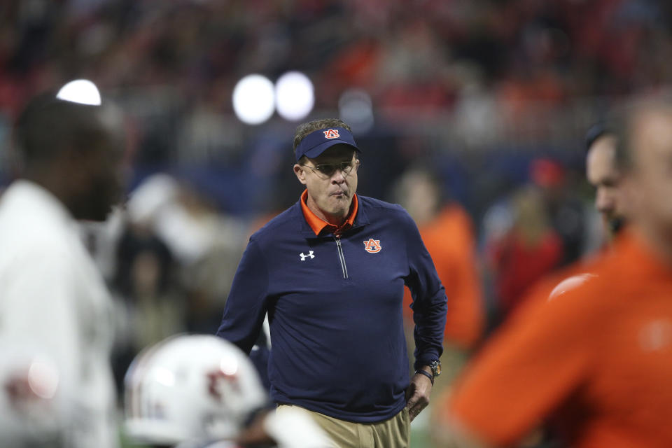 Auburn head coach Gus Malzahn watches teams warm up before the first half of the Southeastern Conference championship vs. Georgia. (AP Photo/John Bazemore)