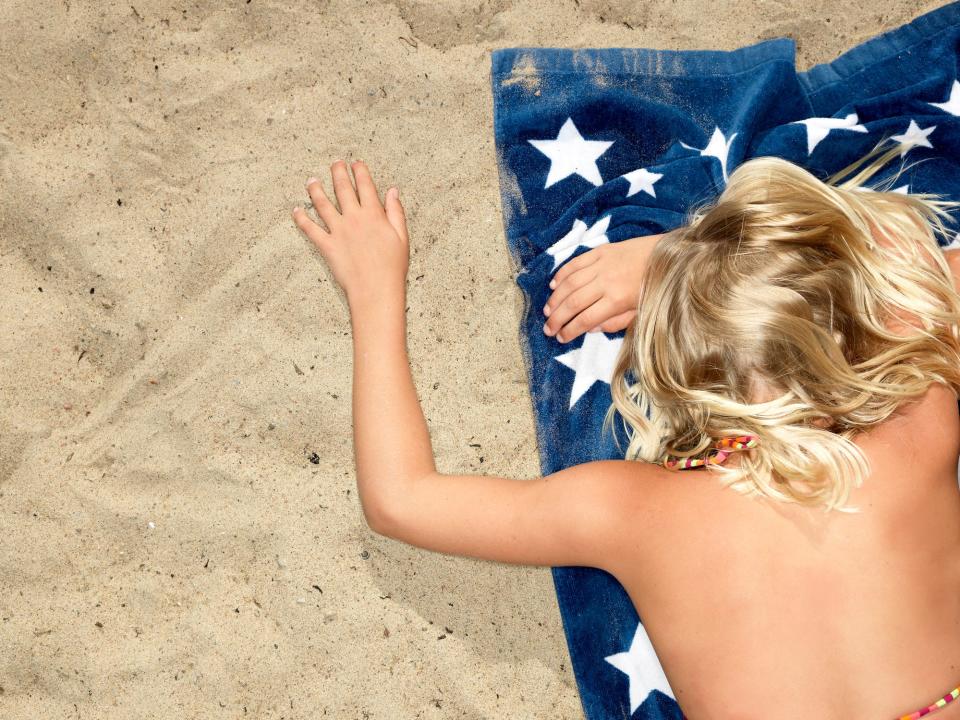Flag towel woman beach