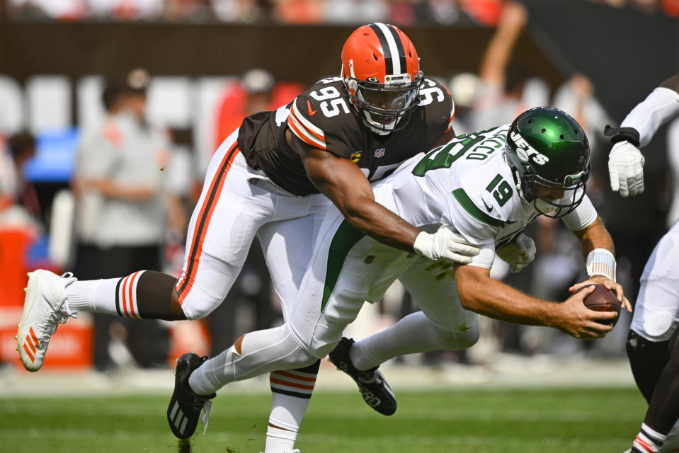 Cleveland Browns defensive end Myles Garrett (95) sacks New York Jets quarterback Joe Flacco (19) during the first half of an NFL football game, Sunday, Sept. 18, 2022, in Cleveland. (AP Photo/David Richard)