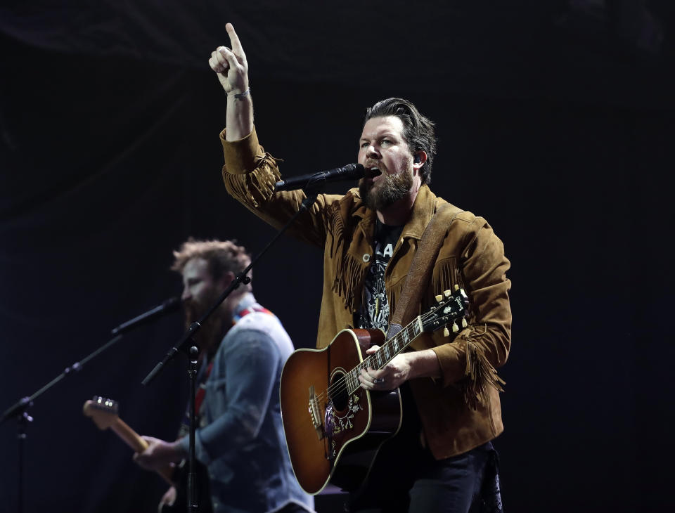 FILE - This Oct. 16, 2018 file photo shows Zach Williams performing during the Dove Awards in Nashville, Tenn. Christian artists Zach Williams and for King & Country are the leading artist nominees at the 2020 Dove Awards, while rapper Kanye West and singer Gloria Gaynor earned their first ever nominations.(AP Photo/Mark Humphrey, File)