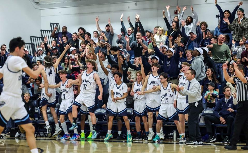 The Camarillo bench and crowd cheer on the Scorpions during their CIF-Southern Section Division 3AA semifinal game against visiting La Serna on Friday night at Camarillo High. La Serna won, 41-38.