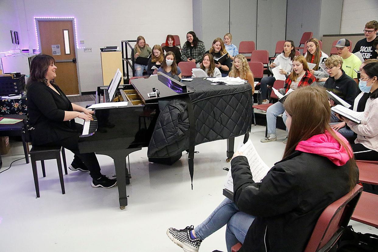 Ashland High School Choir Director Kim Wolbert plays the piano during a May 3 rehearsal for May Fiesta.