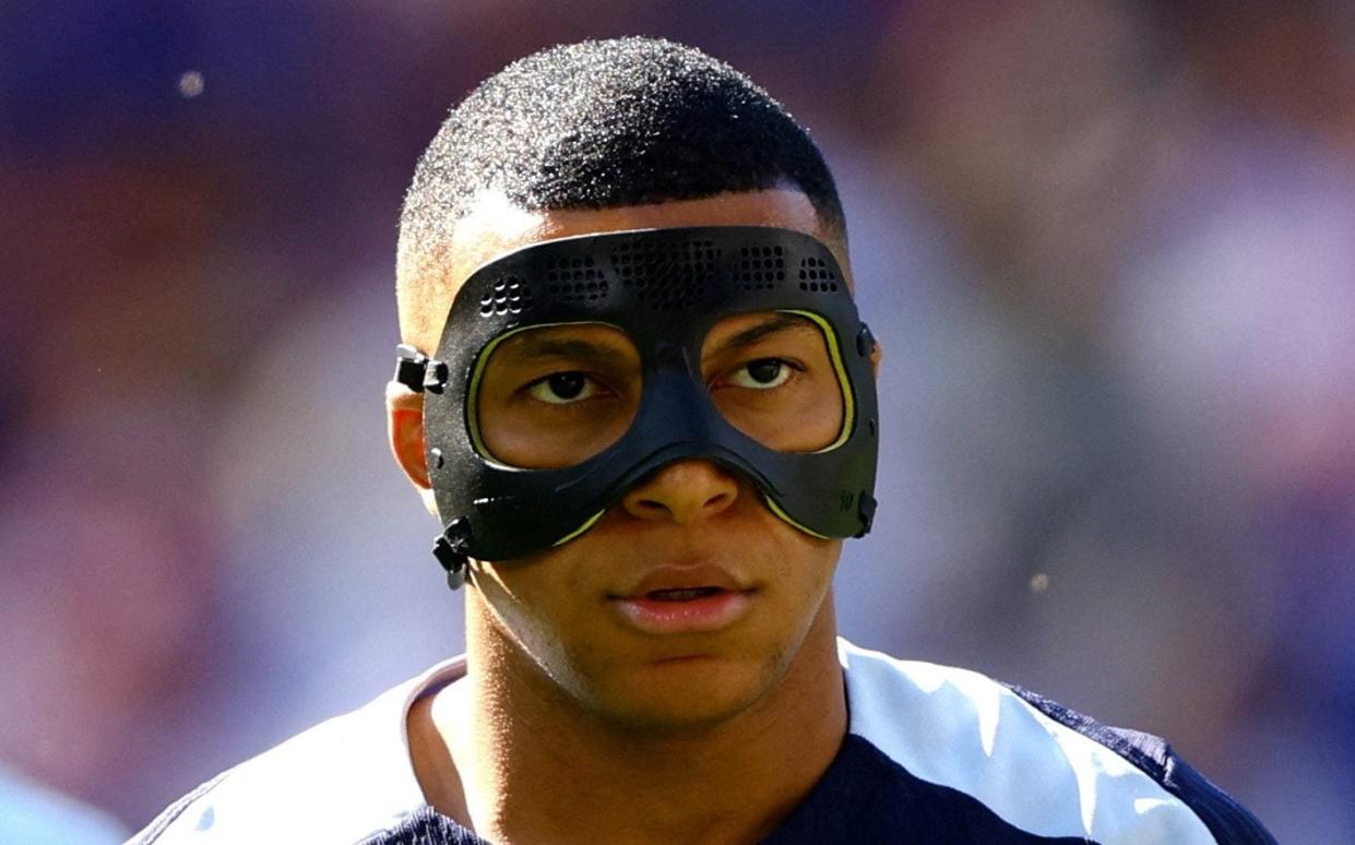 Kylian Mbappe in a mask