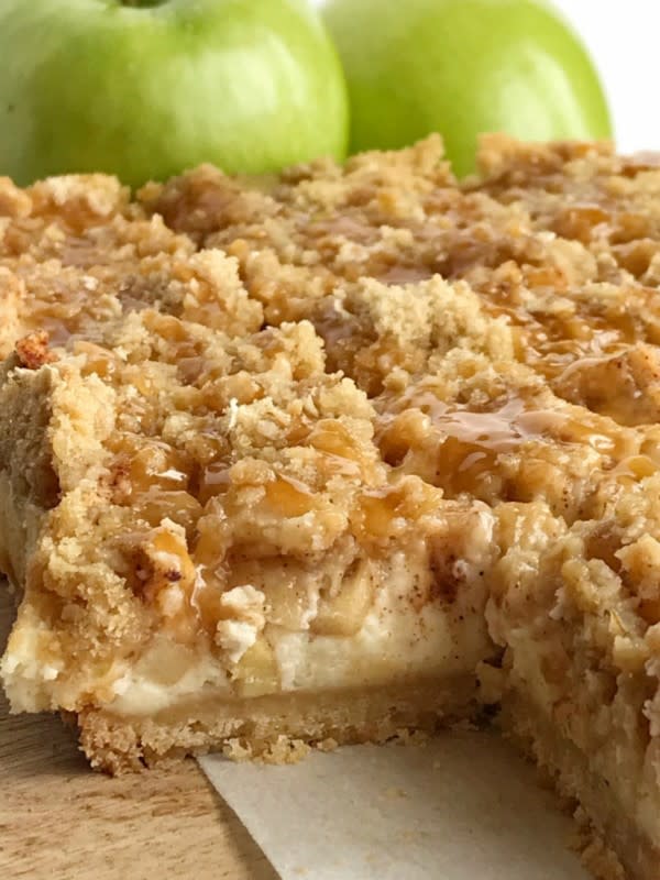 <p>Together as a Family</p><p>Caramel apple cheesecake bars have a shortbread crust, creamy cheesecake, cinnamon sugar apples, and a brown sugar oat crumble. Drizzle with caramel sauce for a delicious apple dessert recipe. </p><p><strong>Get the recipe: <em><a href="https://togetherasfamily.com/caramel-apple-cheesecake-bars/" rel="nofollow noopener" target="_blank" data-ylk="slk:Caramel Apple Cheesecake Bars;elm:context_link;itc:0;sec:content-canvas" class="link ">Caramel Apple Cheesecake Bars</a></em></strong></p>