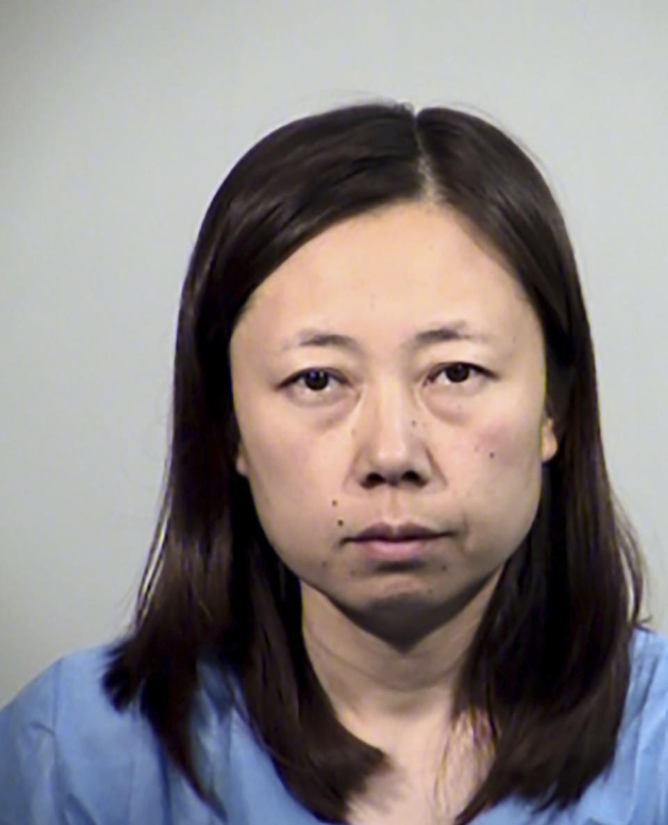 This Saturday, May 15, 2021, booking photo released by Tempe Police Department shows Yui Inoue, 40, who is jailed for allegedly killing her two children in Temple, Ariz. Yui Inoue remained jailed on suspicion of two counts of first-degree murder, according to Tempe police. It was unclear Sunday, May 16, 2021, if Inoue has a lawyer yet. Police said the woman primarily speaks Japanese and had an interpreter for a post-Miranda interview. Inoue drove to a police station about 7 a.m. Saturday and told officers she was hearing voices telling her to kill her children, authorities said. (Tempe Police Department via AP)