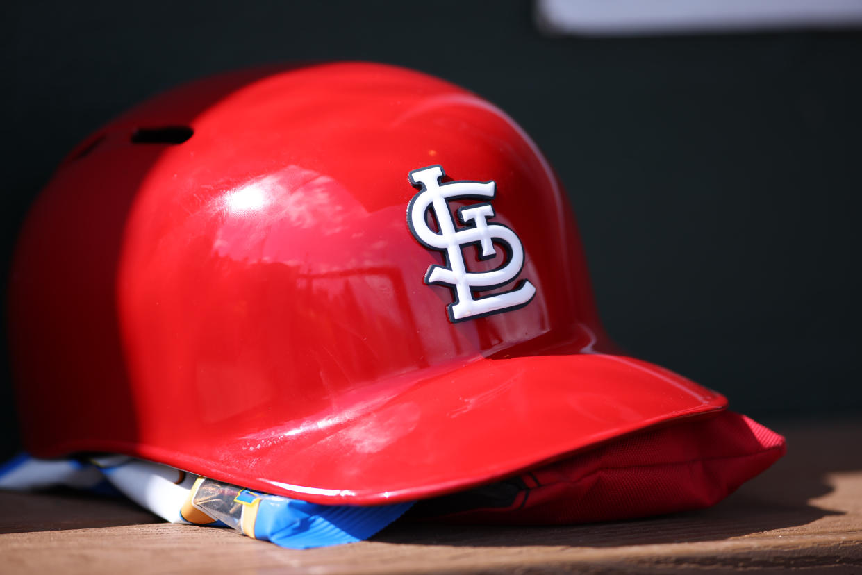 JUPITER, FL - APRIL 05: A St. Louis Cardinals batting helmet rests in the dugout during the spring training game between the St. Louis Cardinals and the Miami Marlins on Wednesday, April 6, 2022 at Roger Dean Stadium in Jupiter, Florida (Photo by Peter Joneleit/Icon Sportswire via Getty Images)