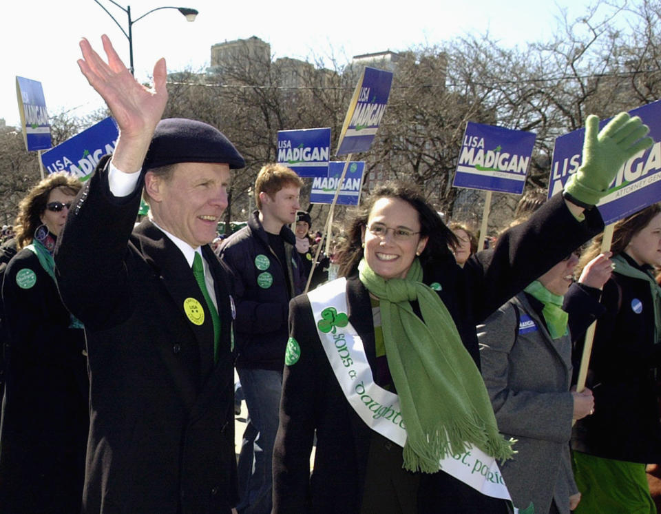 FILE - Then-Illinois House Speaker Michael Madigan, left, walks with his daughter, Lisa Madigan, then the Democratic candidate for Illinois attorney general, in the St. Patrick's Day parade in Chicago on March 16, 2002. Madigan, the former speaker of the Illinois House and for decades one of the nation’s most powerful legislators, was charged with racketeering and bribery on Wednesday March 2, 2022, becoming the most prominent politician swept up in the latest federal investigation of entrenched government corruption in the state. (AP Photo/Stephen J. Carrera, File)