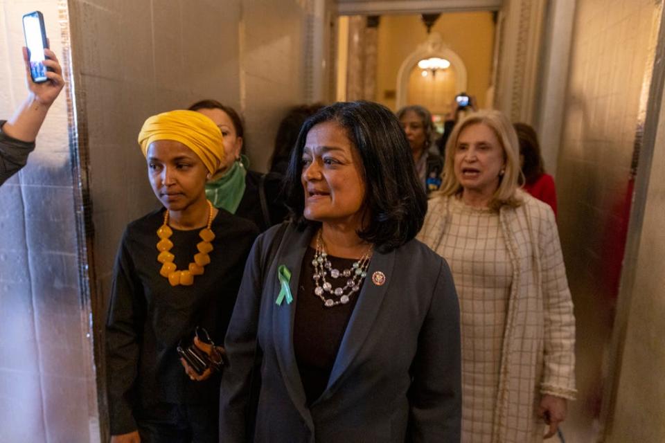 Democratic Reps. Ilhan Oman of Minnesota, from left, Pramila Jayapal of Washington and Carolyn Maloney of New York chant, "My body, my decision," while walking to the Senate in the U.S. Capitol on May 11.