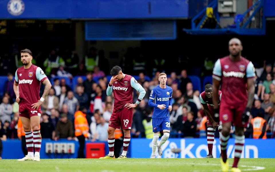 West Ham United's Edson Alvarez (centre left) shows his dejection after Chelsea scored their third goal of the game