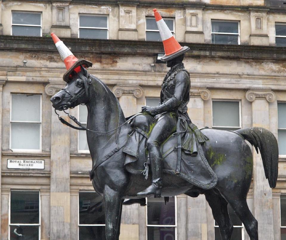 This undated photo shows a statue of the Duke of Wellington in Glasgow, Scotland. The statue is rarely seen without a traffic cone on its head. It started as a joke by students decades ago but is now an almost permanent symbol of local humor. Visiting the famous monument with its cones is one of a number of free things to see and do in Glasgow. (AP Photo/ Stewart Cunningham)