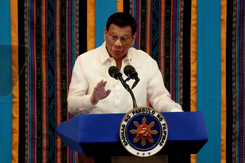 FILE PHOTO: Philippine President Rodrigo Duterte gestures during a speech in Quezon City, Philippines