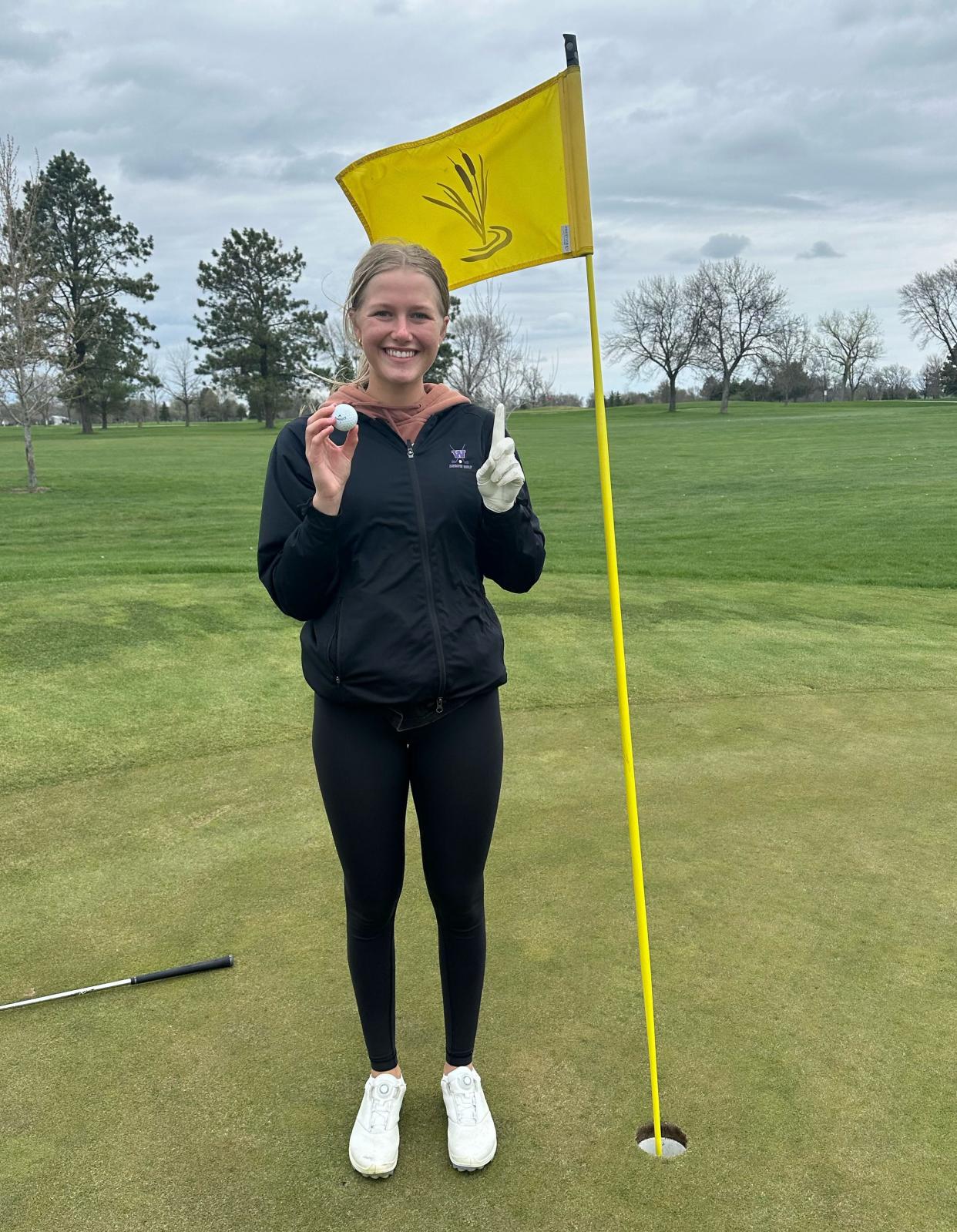 Watertown High School senior girls golfer Aspen Reynolds is pictured after making a hole-in-one on the par-3 No. 6 yellow hole at Cattail Crossing Golf Course on Monday, May 6, 2024.