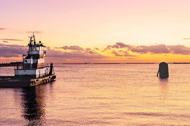 <p>Robbie Caponetto</p> Take in the sunset over Cape Charles Harbor from Shanty seafood restaurant.