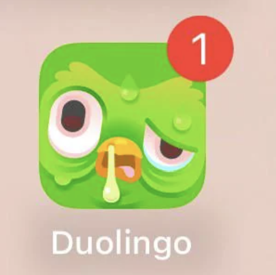 Duolingo app icon with an angry-looking green owl and a red notification badge showing the number 1