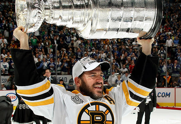 The Stanley Cup in a Pool, From L to R Mark Recchi, Rod Bri…