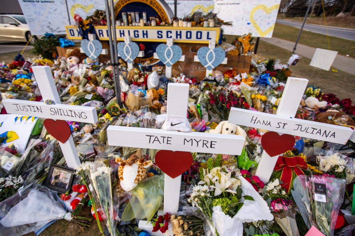 A memorial continues to grow at an entrance to Oxford High School on December 7, 2021, after an active shooter situation at Oxford High School that left four students dead and multiple others with injuries.