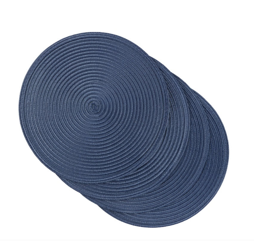 set of four circular dark blue knit placemats