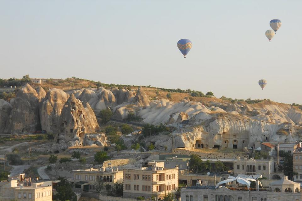 Colourful hot air balloons can be found across the sky (Jennifer Hattam)