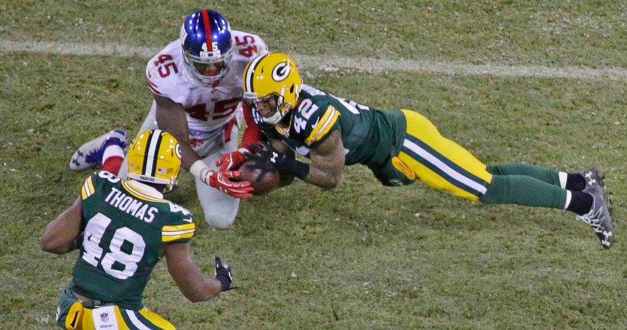 Green Bay Packers safety Morgan Burnett breaks up a pass intended for New York Giants tight end Will Tye.