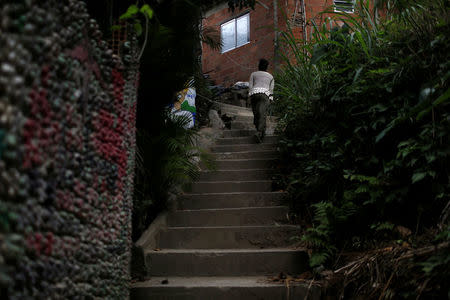 Solange, a worker at Pousada Favelinha hostel, returns to the hostel in Pereira da Silva favela, in Rio de Janeiro, Brazil, April 29, 2016. REUTERS/Pilar Olivares