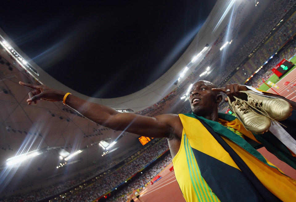 Is Usain Bolt the fastest man in the world or will there be a new champion in London? At the Beijing Games in 2008, Bolt, a Jamaican sprinter, captured the world’s eye when he clocked in 9.69 seconds to earn gold and break the world record. He continued to celebrate on the track with his team, posing in front of the clock marking his record time. (Photo by Alexander Hassenstein/Bongarts/Getty Images)