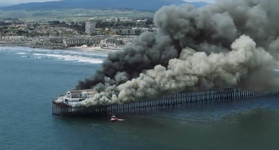 Flames erupted at a vacant restaurant at the end of the pier. (Lawnchaircreative.com)