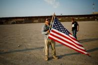 FILE PHOTO: Military veterans walk on the border between the U.S. and Mexico to request their return to the United States, in Sunland Park